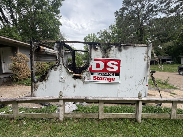 Storage shed destroyed by fire before demolition and haul-off