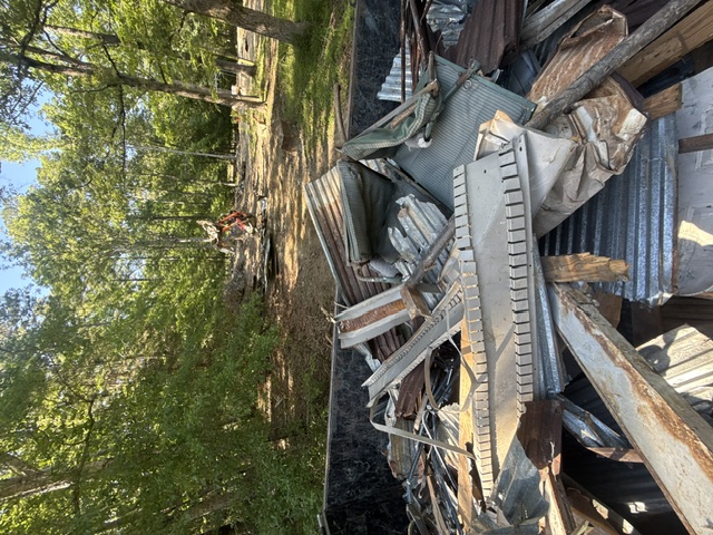 Same debris loaded into truck and hauled off the property
